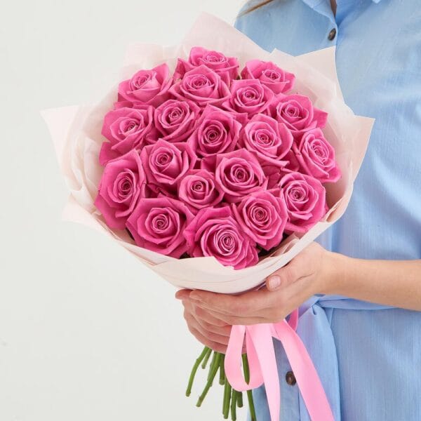 Elegant 20 pink roses bouquet wrapped in eco-friendly material, perfect for celebrations in Dubai.