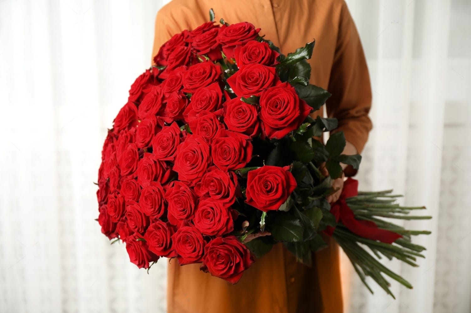 A woman holding Luxury Flower Delivery Dubai