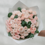 Delicate pink baby rose bouquet arranged elegantly for weddings and special occasions in Dubai.