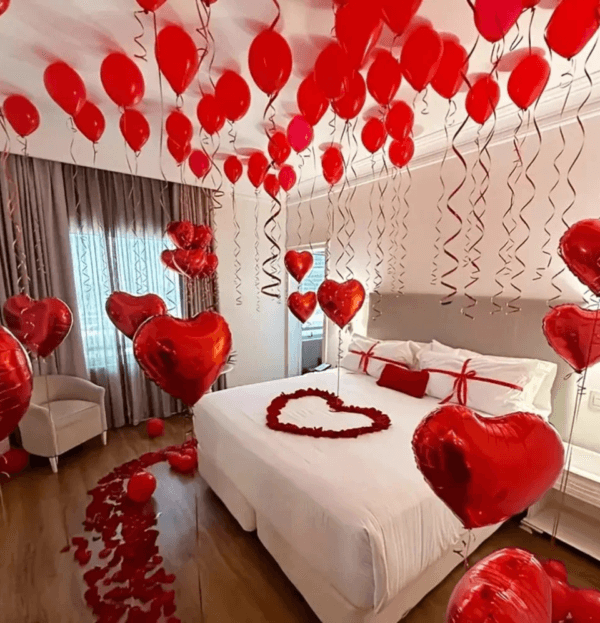 Eternal Love Bliss Dubai - Romantic room decoration with 201 red roses, heart-shaped balloons, and rose petals perfect valentines day flowers and surprises