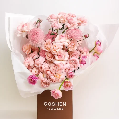 Blushing Bloomscape a blush pink flower bouquet with roses, spray blooms, and chrysanthemums in a luxury brown box – Goshen Flower Dubai.