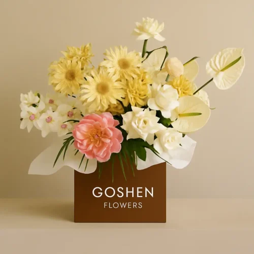 golden grace bouquet with yellow gerberas, white roses, pink peony and orchids in a brown gift box – luxury flower delivery in Dubai.