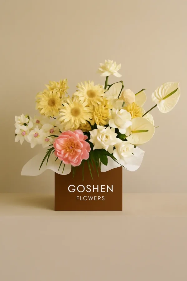 golden grace bouquet with yellow gerberas, white roses, pink peony and orchids in a brown gift box – luxury flower delivery in Dubai.