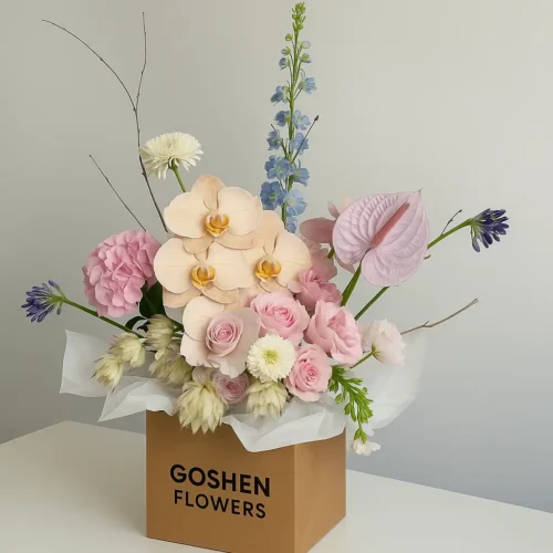 Sahara Blush a luxury blush pink bouquet with orchids and carnations in white wrapping – perfect for birthdays, anniversaries, and flower delivery in Dubai.