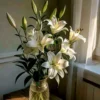 Hand-tied white lily bouquet by Goshen Flower – available in small, medium, and luxe sizes with free message card – perfect for birthdays, anniversaries, sympathy, and weddings in Dubai.